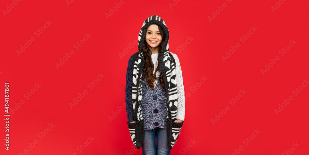 child wearing warm clothes. express positive emotion. winter fashion.