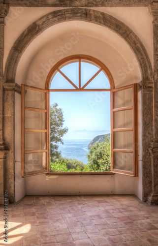 Naples, Ischia, Italy - July 05 2021: Window overlooking the sea of Ischia Naples