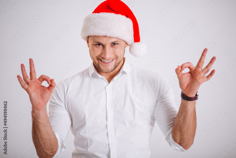Business man showing emotions in santa hat isolated Business man showing emotions in santa hat isolated