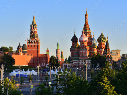 Saint Basil's Cathedral and Spasskaya Tower of the Moscow Kremlin in the morning.