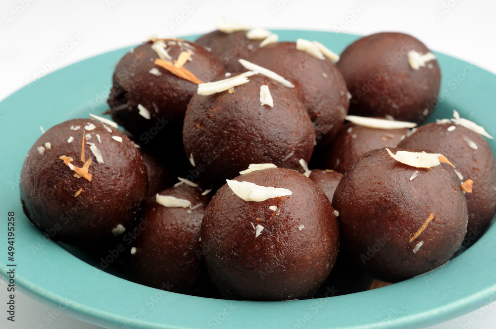 Kala Jamun with almond toppings, Indian dessert Kala Jamun with almond toppings, Indian dessert