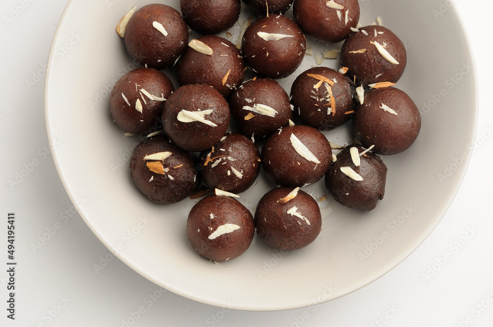 Kala Jamun with almond toppings, Indian dessert Kala Jamun with almond toppings, Indian dessert