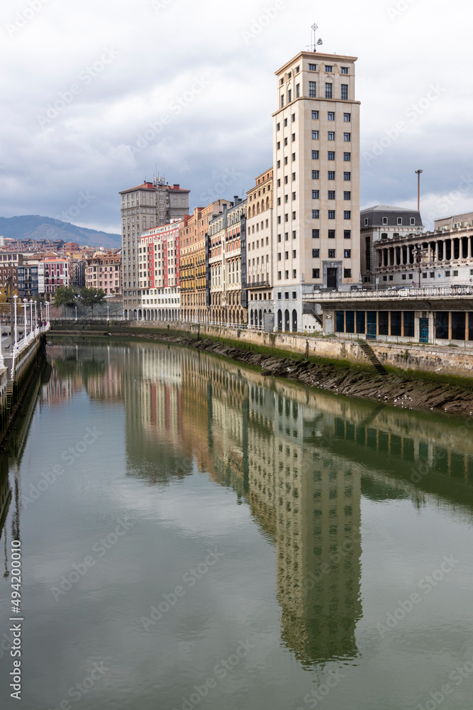 old building on the bank of the ria de bilbao in the north of spain