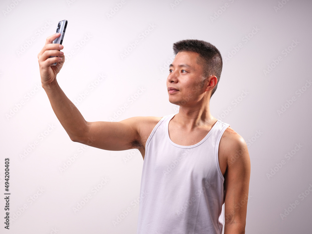 A man in a white vest A man in a white vest