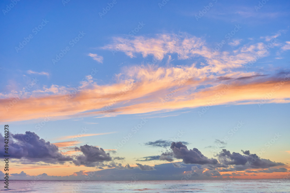 Landscape of peaceful calm sky wallpaper with fluffy clouds and sea