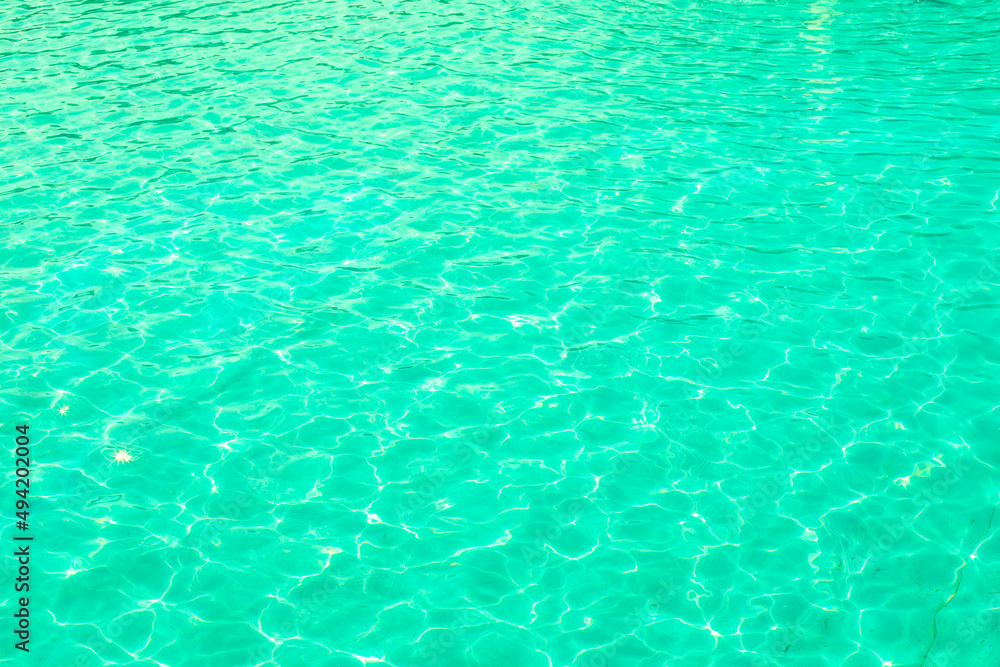 Pool water with a greenish tint, water ripple texture