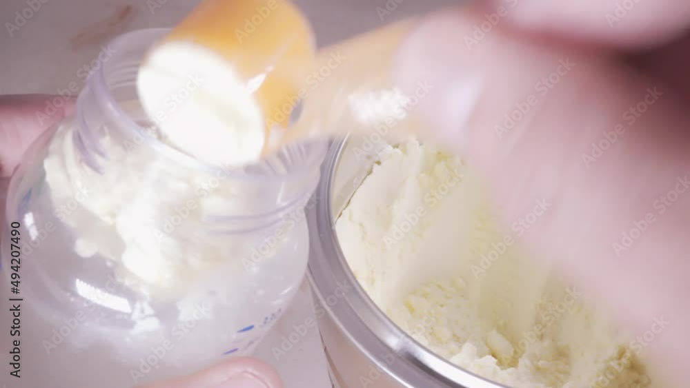 4K B-roll clips of preparing formula milk bottle for baby. Selective focus 4K B-roll clips of preparing formula milk bottle for baby. Selective focus