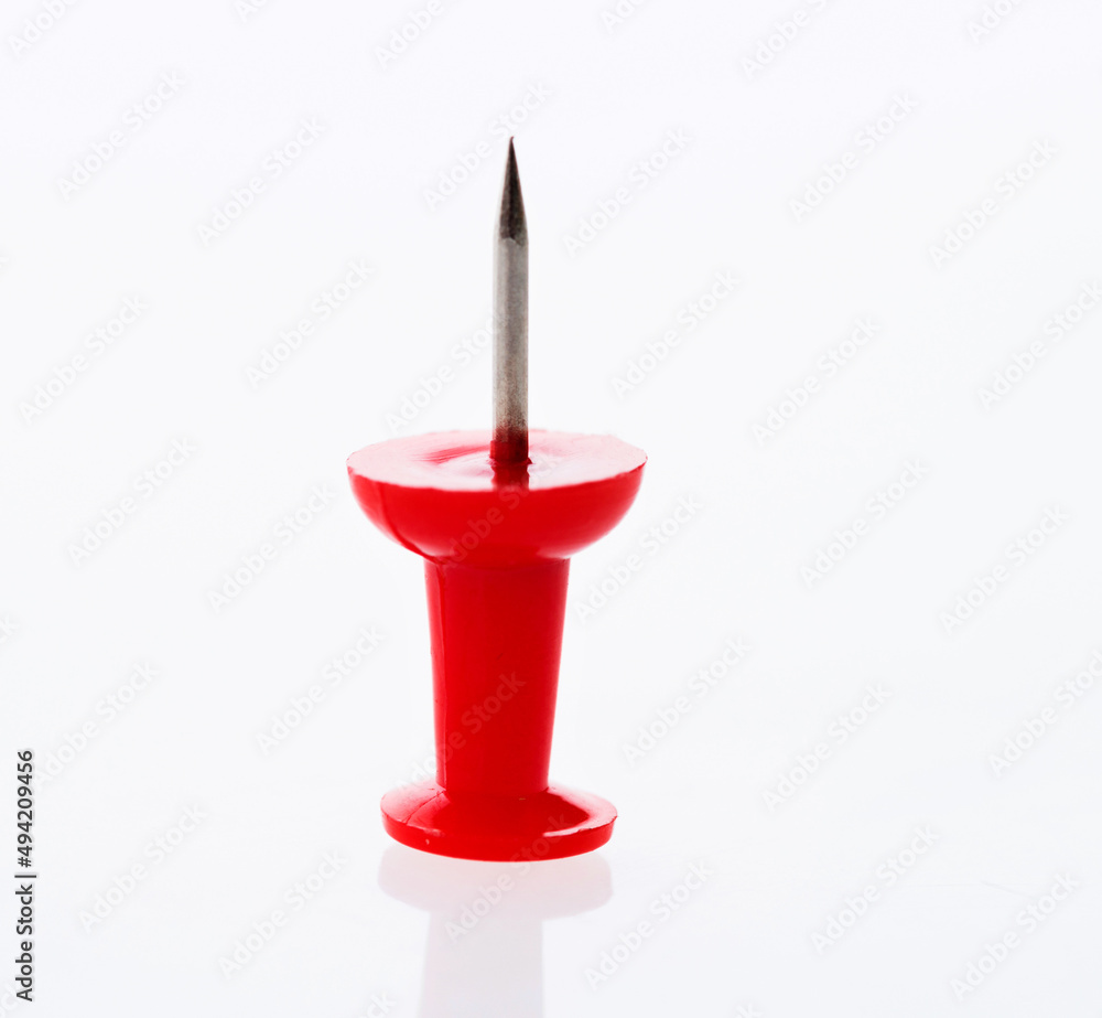 Single push pin isolated on white background Single push pin isolated on white background