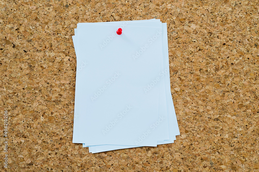 Several untidy notes pinned on cork Several untidy notes pinned on cork