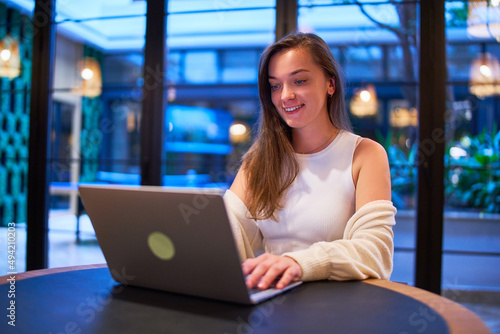 Happy cute joyful modern smiling satisfied smart young casual businesswoman using laptop for working online Free Download Happy cute joyful modern smiling satisfied smart young casual businesswoman using laptop for working online - GFXLoad