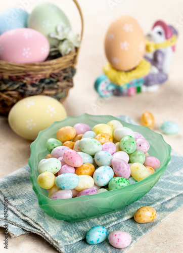 Bowl of easter candy and colored eggs