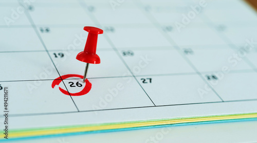 Push pin on calendar in 26th of month