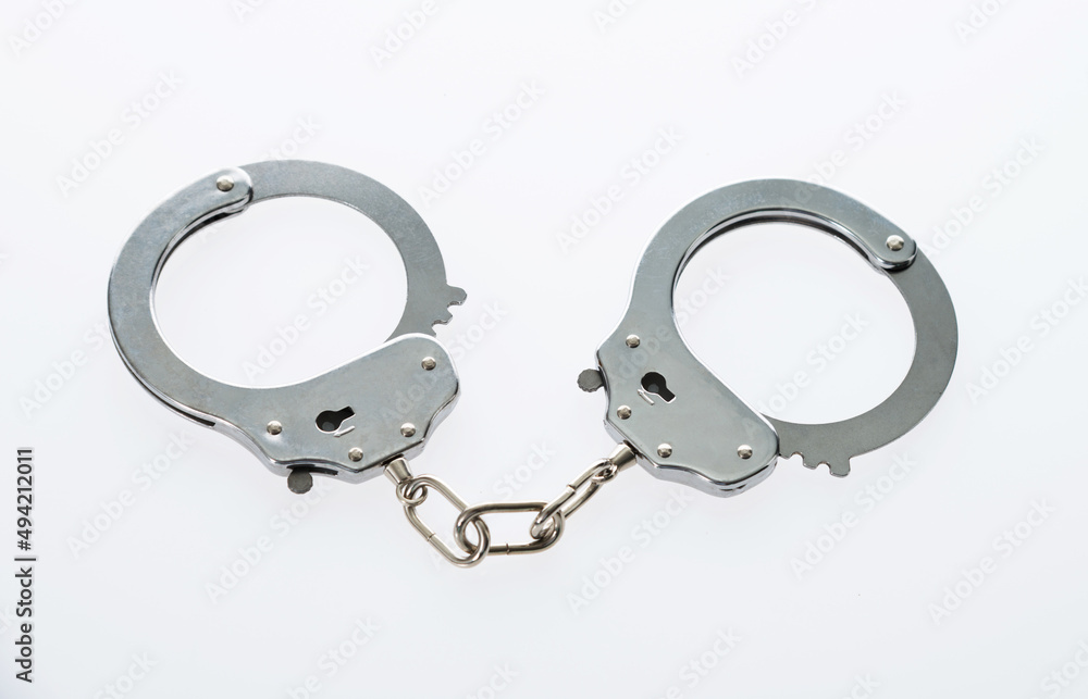 Handcuffs isolated on white background Handcuffs isolated on white background