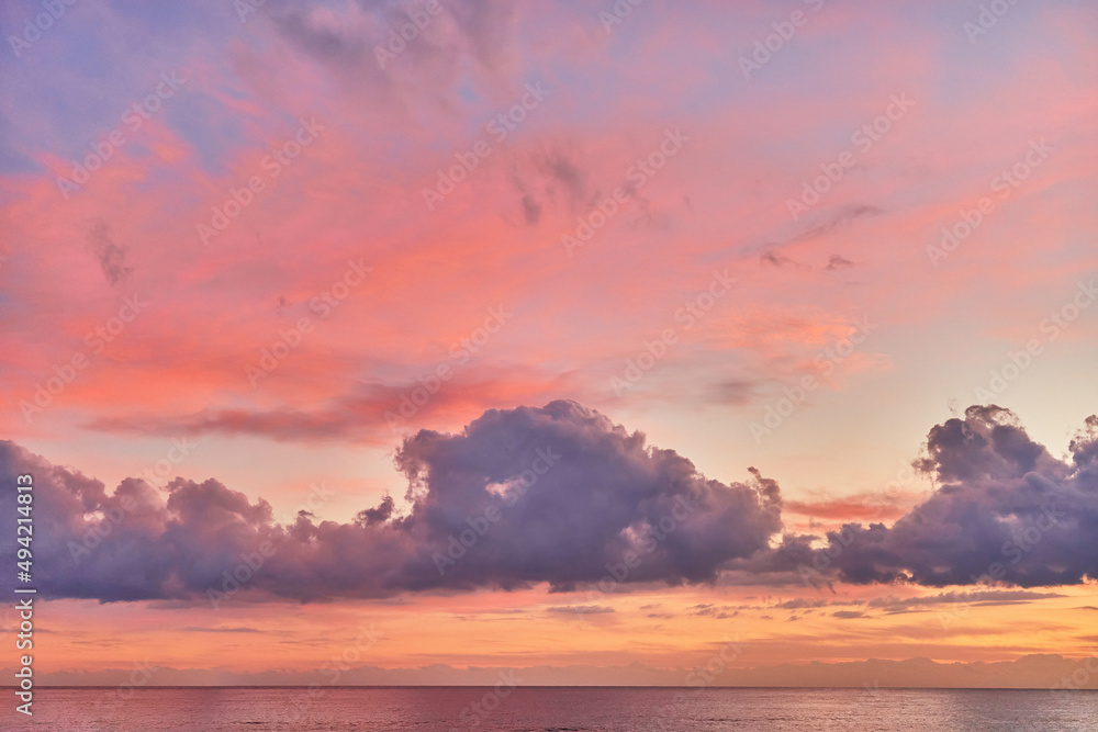 Landscape of paradise serene calm gradient pink idyllic sky with fluffy clouds