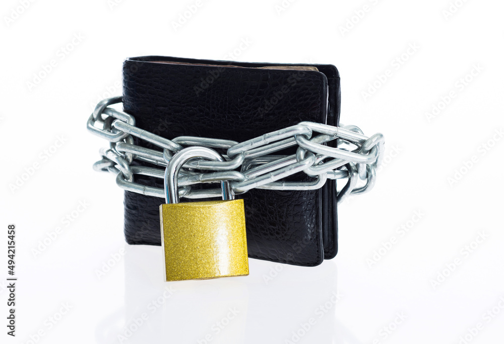 Leather wallet in chains with padlock on white background Leather wallet in chains with padlock on white background