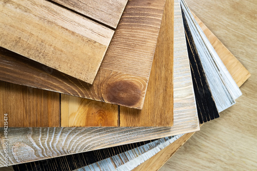 Stack of various construction sample wood boards.
