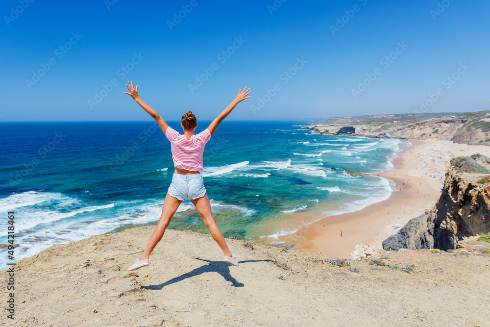 Girl having fun on the ocean. Lagos, Algarve Coast, Portugal