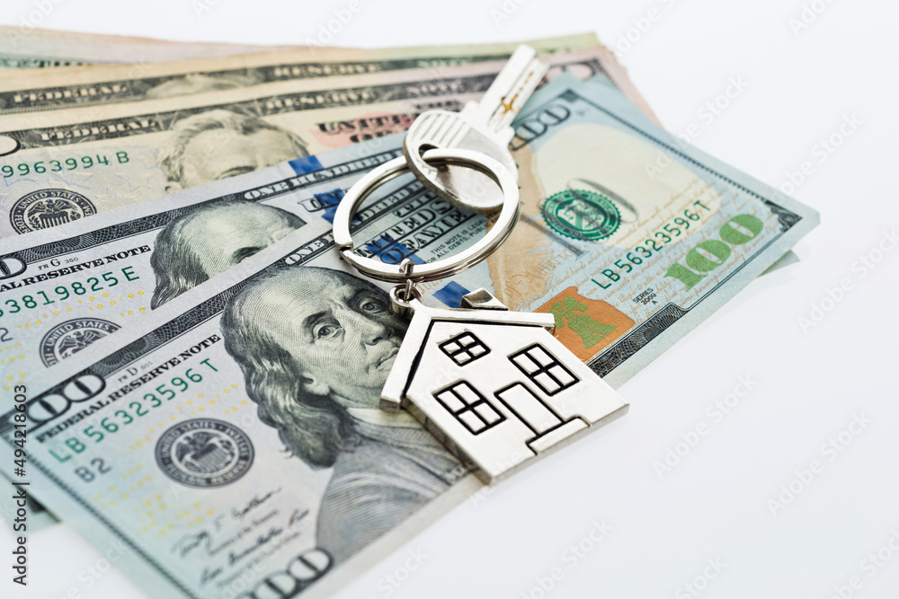 House key over the hundred dollar banknotes House key over the hundred dollar banknotes