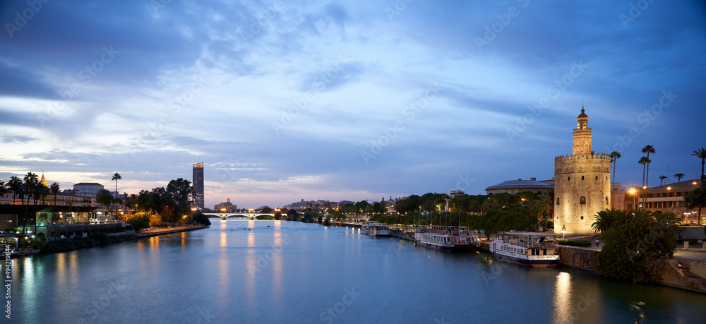 Panoramic night view of the Guadalquivir river in Seville.