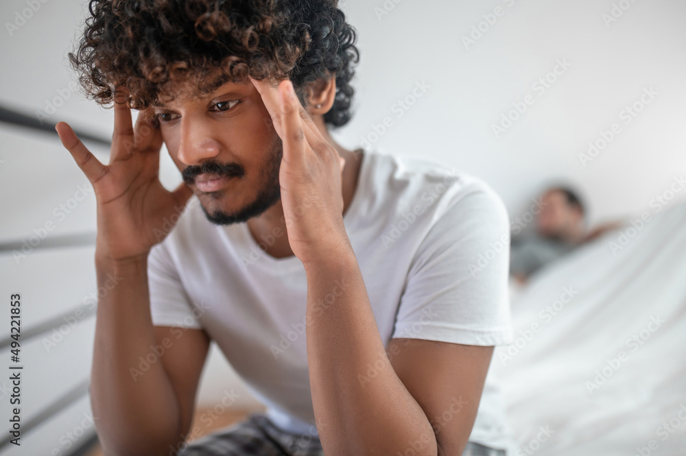 Guy suffering from headache after the quarrel with his lover Guy suffering from headache after the quarrel with his lover