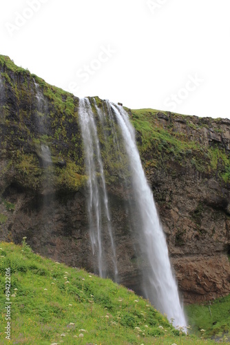 World famous Icelandic Seljalandsfoss waterfall with its characteristic veil  vertical   Seljalandsfoss  Iceland