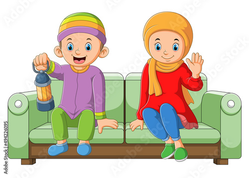 The couple is sitting together in the ramadan night