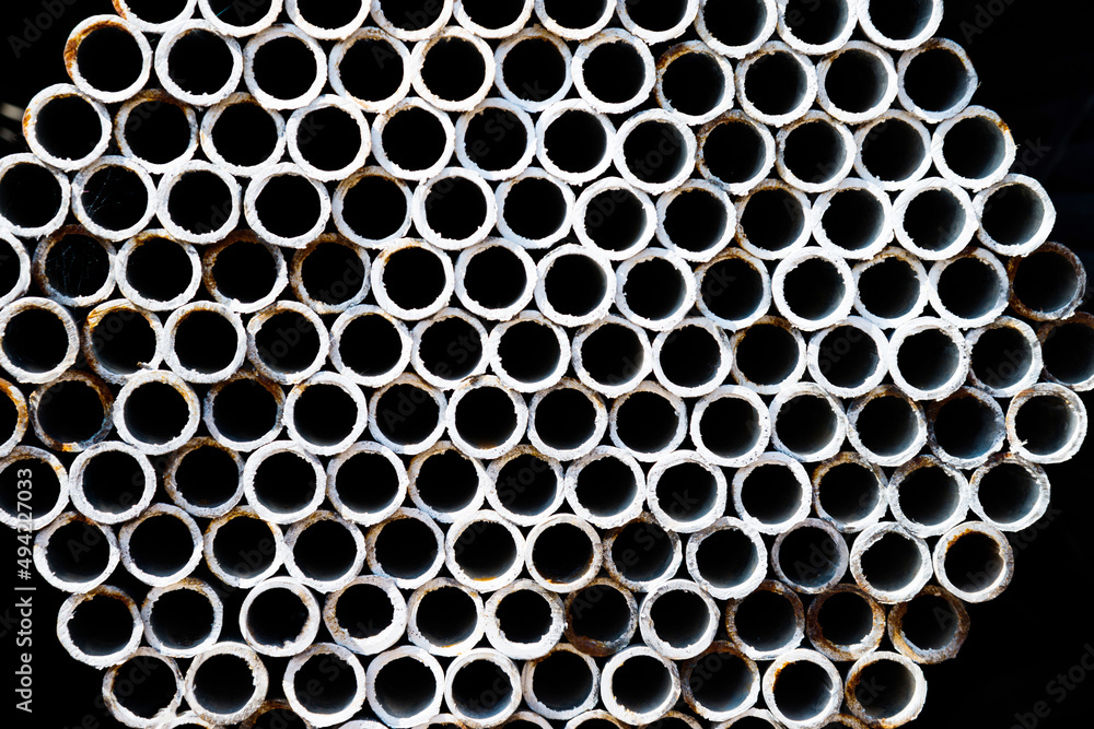 Stack of round metal pipes Stack of round metal pipes