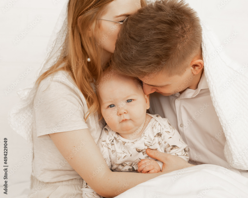 Portrait of tranquil and calm cozy married couple, kissing family. After hospital treatment home. Protection, safety kid Portrait of tranquil and calm cozy married couple, kissing family. After hospital treatment home. Protection, safety kid