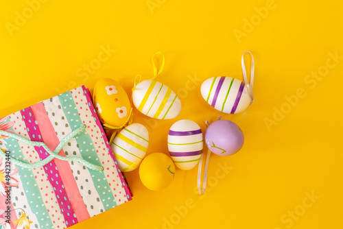 Colorful Easter egg and shopping. Yellow banner background.