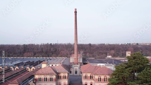 The main gate and the chimney of the factory at UNESCO world heritage site worker’s village in Lombardy. photo