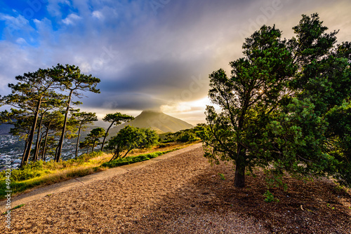 A colorful sunset with dramatic clouds over Lion's Head in Cape Town.