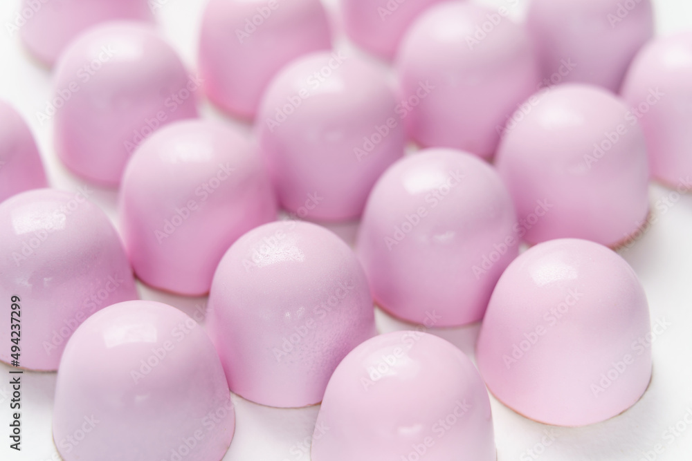 Exclusive handmade chocolate candy painted with pastel colo Exclusive handmade chocolate candy painted with pastel colo