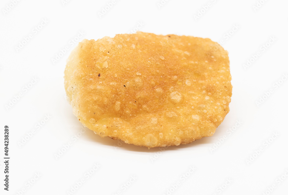 Puffed fried luchi or puri isolated on a white background Puffed fried luchi or puri isolated on a white background