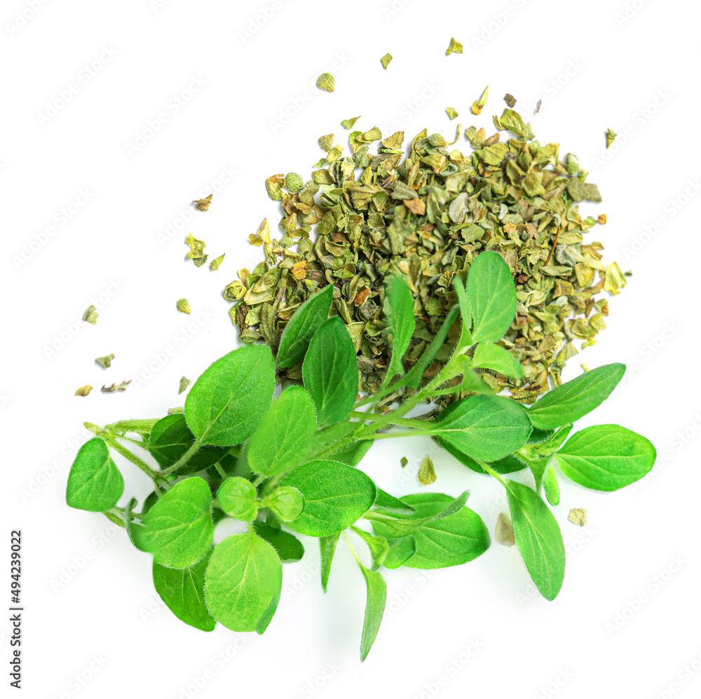 Dried parsley flakes with fresh parsley leaves isolated on white background, top view. Flat lay
