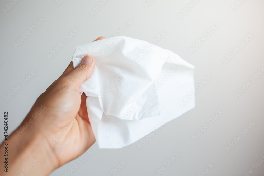 hand holding crumpled paper hand holding crumpled paper