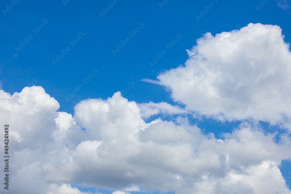 Natural daylight and white clouds floating on blue sky. Concept of freedom and relaxation. Natural daylight and white clouds floating on blue sky. Concept of freedom and relaxation.