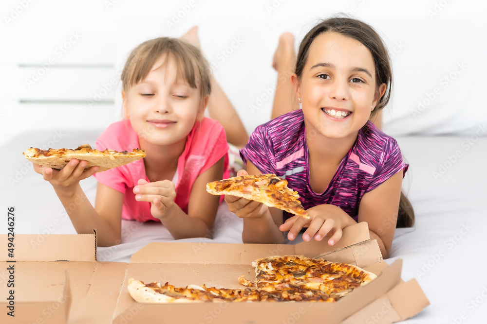 Attractive little girls posing with pizza boxes Attractive little girls posing with pizza boxes