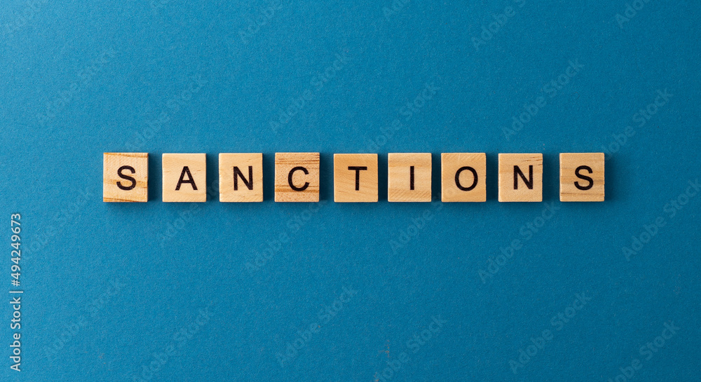 Sanctions stop war background. Sanction phrase from wooden letters. Top view words. The phrases is laid out in wood letter. Motivation. Sanctions stop war background. Sanction phrase from wooden letters. Top view words. The phrases is laid out in wood letter. Motivation.