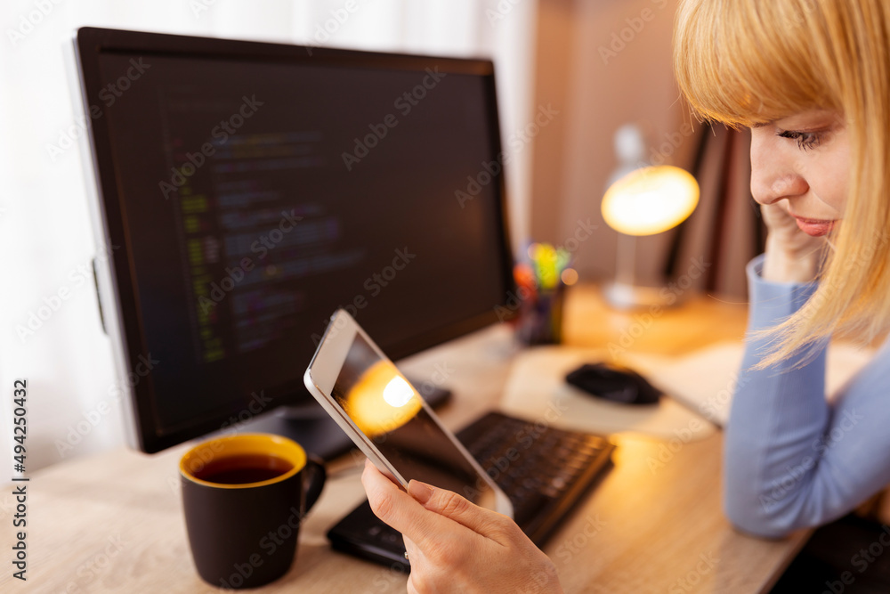 Female web developer working remotely from home Female web developer working remotely from home