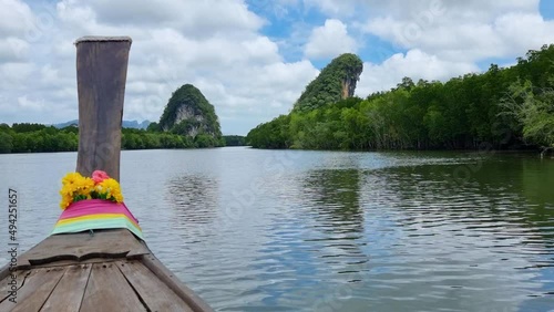 Long tail boat on sea and mountains, View from Long tail boat in Krabi, Thailand. at bluesky cloud. Tropical seascape view island thailand. (Khao nam khanap)