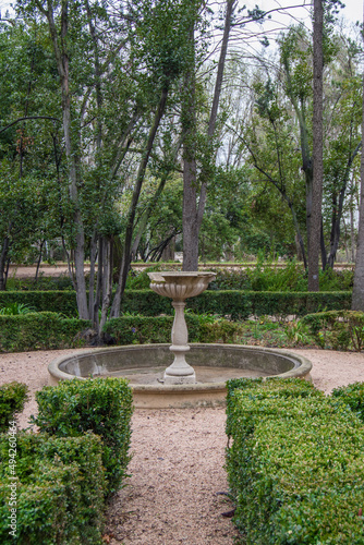 garden with stone fountain in the historic gardens of the fincaa de Vista Alegre in Madrid