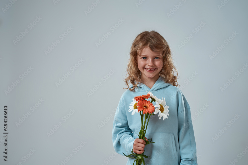 Little girl holding bouquet of flowers for present Little girl holding bouquet of flowers for present