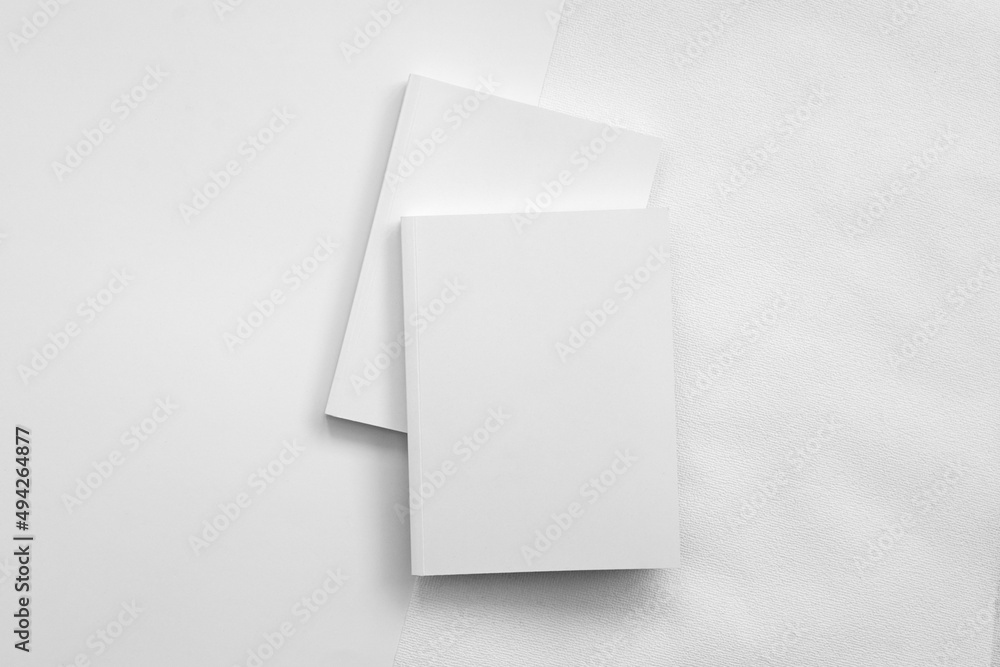Mockup of brochure with fold. Blank mock up of booklet, menu and book. White paper of magazine. Mockup of leaflet. Template of twofold pamphlet isolated on white background.