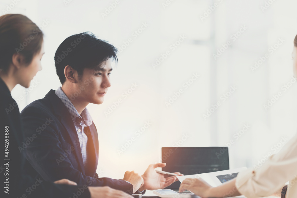 Asian Business consultant working together and management big data and analyze financial budget of company. Fund investment concept. Asian Business consultant working together and management big data and analyze financial budget of company. Fund investment concept.