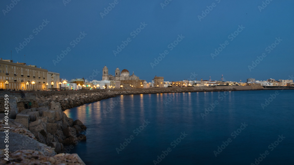 night view of the city of cadiz with the sea