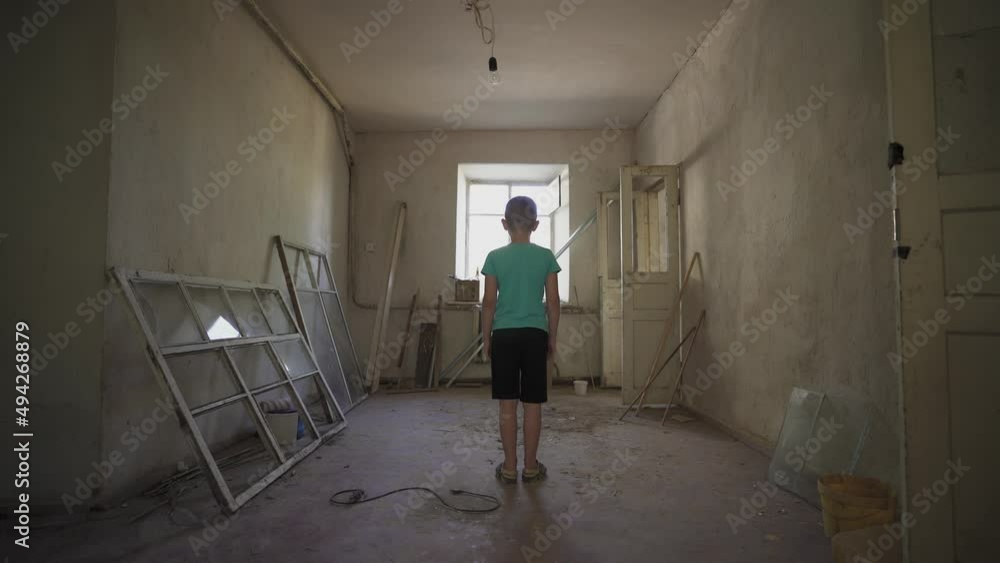 portrait Ukrainian boy in a destroyed house. a homeless child in dirty clothes who suffered from the war of Russia against Ukraine. Children against war. destroyed cities, houses. victims. NO WAR portrait Ukrainian boy in a destroyed house. a homeless child in dirty clothes who suffered from the war of Russia against Ukraine. Children against war. destroyed cities, houses. victims. NO WAR