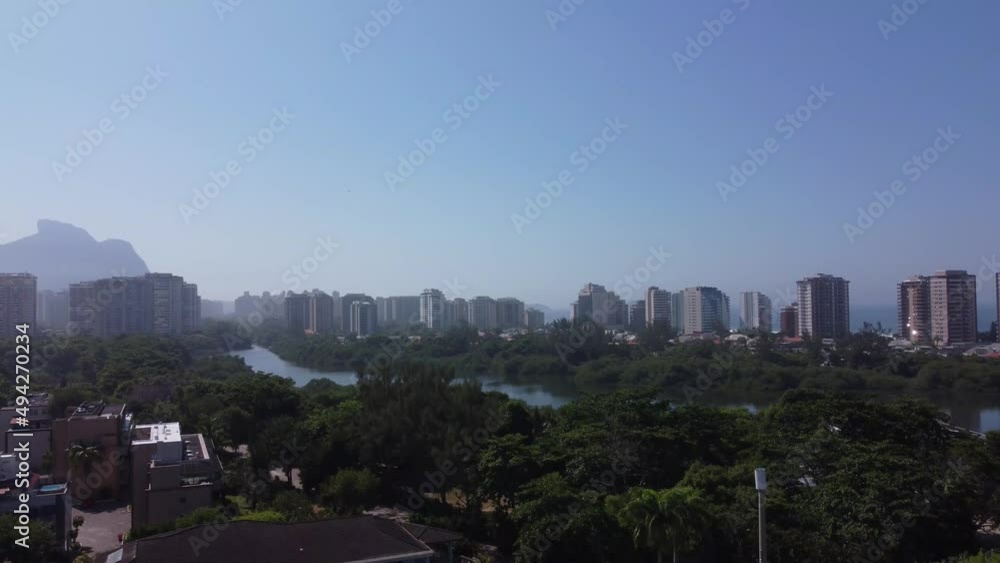 Amazing seaside town in the middle of the mountains with a river flowing by - Barra da Tijuca, Rio de Janeiro, RJ, Brazil - aerial drone view Amazing seaside town in the middle of the mountains with a river flowing by - Barra da Tijuca, Rio de Janeiro, RJ, Brazil - aerial drone view