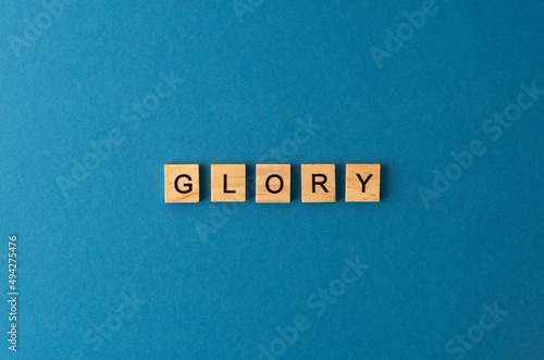 Glory background. Phrase from wooden letters. Top view words. The phrases is laid out in wood letter. Motivation.