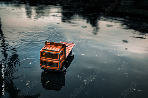 Red Toy Truck in the Rain