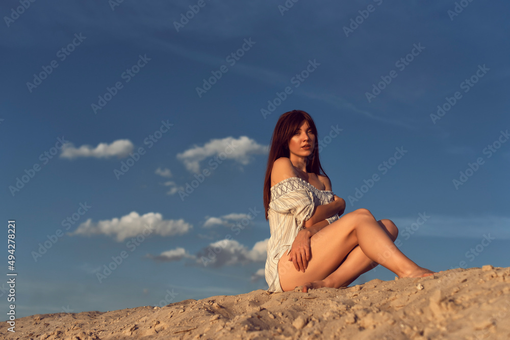 Young brunette woman on a sunny summer day Young brunette woman on a sunny summer day